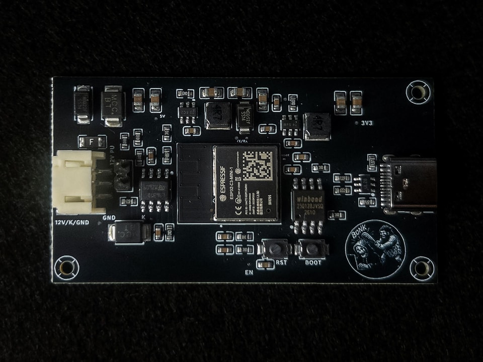 Macro photograph of the BonkCore circuit board, built around an ESP32-C3 module