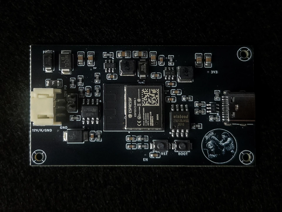 Macro photograph of the BonkCore circuit board, built around an ESP32-C3 module