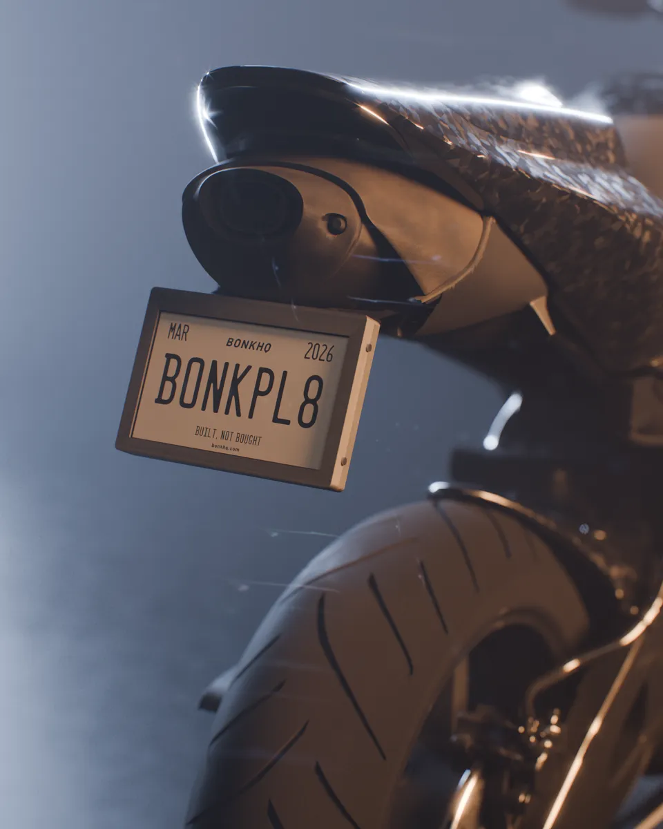 3D render of the BonkPlate prototype on a parked forged-carbon sportbike in studio light